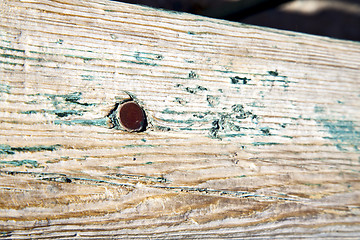 Image showing metal nail dirty stripped paint in green