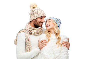 Image showing smiling couple in winter clothes hugging