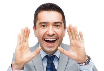 Image showing happy businessman in suit shouting