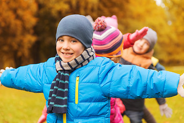 Image showing group of happy children having fun in autumn park