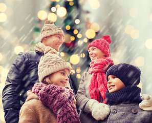 Image showing happy family in winter clothes outdoors