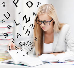 Image showing student with books and notes