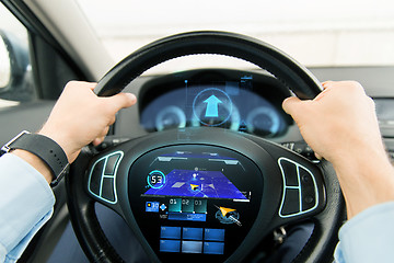 Image showing close up of man driving car with gps navigator