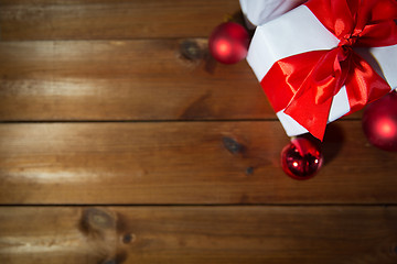 Image showing close up of gift boxes and red christmas balls