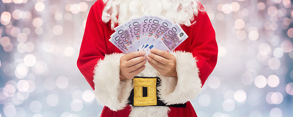 Image showing close up of santa claus with euro money