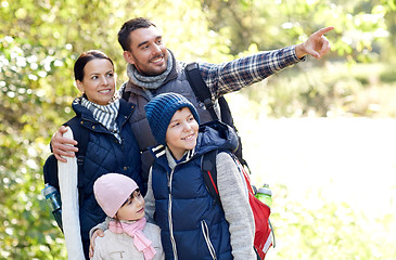 Image showing happy family with backpacks hiking