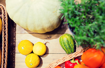 Image showing vegetables in baskets on table at market or farm