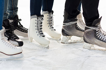 Image showing close up of legs in skates on skating rink