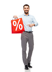 Image showing smiling man with red shopping bag