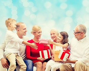 Image showing smiling family with gifts