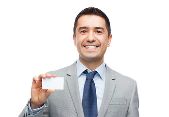 Image showing smiling businessman in suit showing visiting card