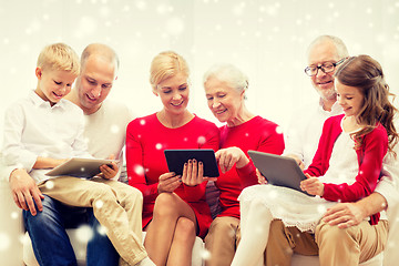 Image showing smiling family with tablet pc computers at home