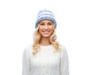 Image showing smiling young woman in winter hat and sweater