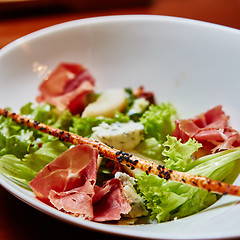 Image showing salad italian style with prosciutto