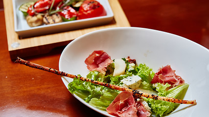 Image showing salad italian style with prosciutto