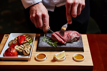 Image showing meat grilled on astone with vegetables