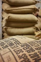 Image showing stack of burlap sacks with coffee beans