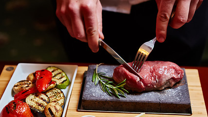 Image showing meat grilled on astone with vegetables