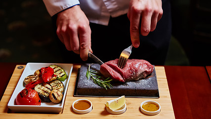 Image showing meat grilled on astone with vegetables