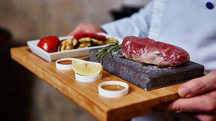 Image showing meat grilled on astone with vegetables