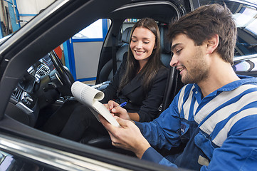 Image showing Car mechanic with customer