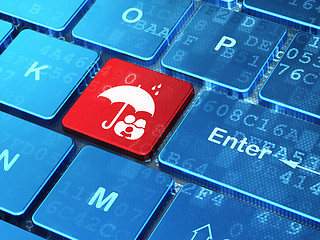 Image showing Protection concept: Family And Umbrella on computer keyboard background