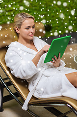 Image showing beautiful young woman with  tablet pc at spa