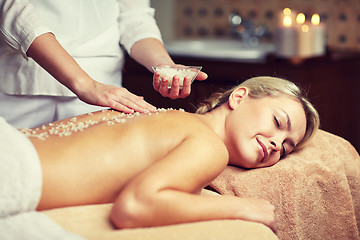 Image showing close up of woman lying and having massage in spa