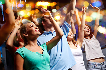 Image showing smiling friends at concert in club