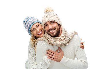 Image showing smiling couple in winter clothes hugging