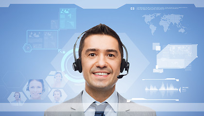 Image showing smiling businessman in headset over virtual screen