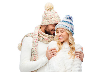 Image showing smiling couple in winter clothes hugging