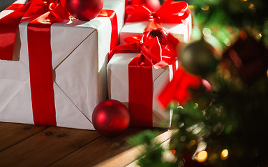 Image showing gift boxes and red balls under christmas tree