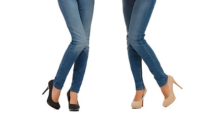 Image showing close up of two women legs in jeans