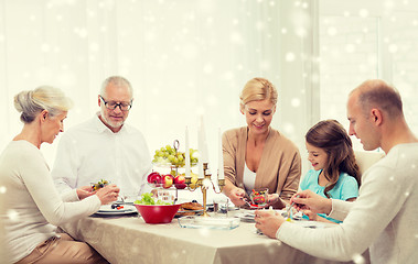 Image showing smiling family having holiday dinner at home