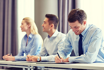 Image showing group of smiling businesspeople meeting in office