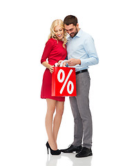 Image showing happy couple looking into red shopping bag