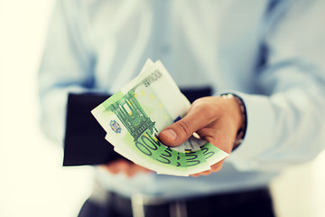 Image showing close up of businessman hands holding money