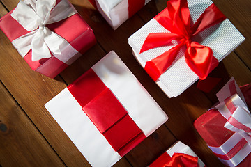 Image showing close up of gift boxes on wooden floor from top