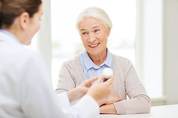 Image showing doctor with medicine and senior woman at hospital