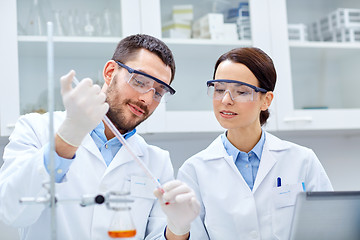 Image showing young scientists making test or research in lab