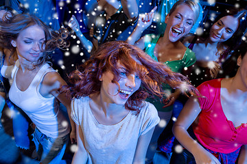 Image showing smiling friends dancing in club