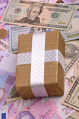 Image showing american money and golden gift box, european money