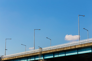 Image showing Bridge over water with lamp pole