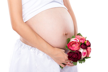 Image showing Pregnant woman hold with flower