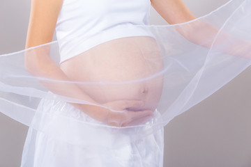 Image showing Pregnant woman in white chiffon shawl