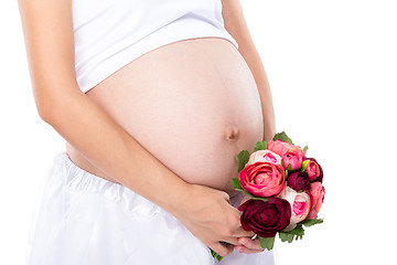 Image showing Pregnant woman hold with flower