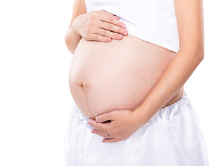 Image showing Pregnant woman touching her belly