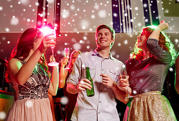 Image showing smiling friends with wine glasses and beer in club