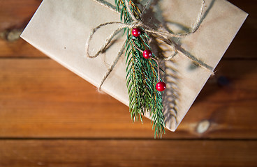 Image showing close up of christmas gift box with fir brunch